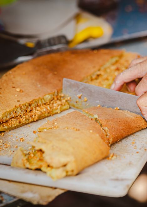 And try legendary dishes like this crisp and fluffy apam balik. 